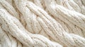Close-Up of White Knit Fabric with Intricate Cable Stitch Pattern Royalty Free Stock Photo