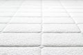 Close-up of white mattress texture. Royalty Free Stock Photo