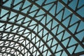 Close-up of a white metal arch with a glass roof against a blue sky Royalty Free Stock Photo