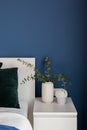 Close-up on white nightstand with decorations