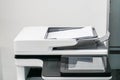 Close up white office printer with mock up paper sheet