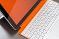White orange convertible laptop and keyboard