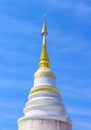 White pagoda ancient with gold on the top on clear blue sky background at upakut Temple, Chiang mai, Thailand Royalty Free Stock Photo