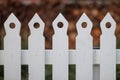 Detailed view of white picket fence