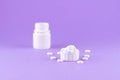 Close up white pill bottle with spilled out pills and capsules in cap on purple background with copy space. Focus on foreground, s Royalty Free Stock Photo