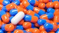 Close up of white pill capsule in many orange and blue pills capsules. Medicine and Specialty Pharmaceuticals concept.,3d model Royalty Free Stock Photo