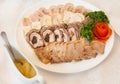 Close up of white plate full of meat appetizers decorated with r Royalty Free Stock Photo