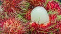 Close up of white pulp rambutan among red Royalty Free Stock Photo