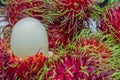 Close up of white pulp rambutan among red rambutan