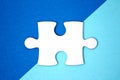 Close up white puzzle piece over a geometry blue background Royalty Free Stock Photo