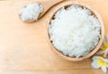 Close up white rice in wooden bowl with spoon, healthy food, selective focus Royalty Free Stock Photo