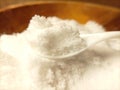 Close up white salt at white spoon Royalty Free Stock Photo