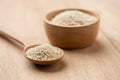 Close up of white sesame seed on wooden spoon in kitchen Royalty Free Stock Photo