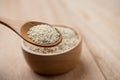 Close up of white sesame seed on wooden spoon in kitchen Royalty Free Stock Photo