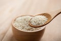 Close up of white sesame seed on wooden spoon in kitchen Royalty Free Stock Photo