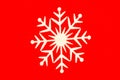 Close-up of white snowflake on red background Royalty Free Stock Photo