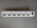 Close up white socket on a grey table with copy space