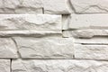 Close-up of white solid limestone wall or stone fence. Abstract copy space background, Bricklaying, construction and masonry