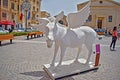 A close up of a white statue of a flying horse in Valletta in Malta