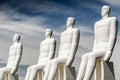 Close up of white statues of men on the beach of Denmark. Mennesket ved Havet or Men at sea. editorial Royalty Free Stock Photo