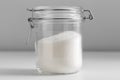 close up of white sugar glass jar on table