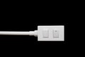Close-up White Switch And Plug isolated on black background Royalty Free Stock Photo