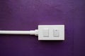 Close-up White Switch And Plug on Purple wall Royalty Free Stock Photo