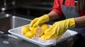 Close up of white tableware, girl washing dishes in bright industrial kitchen with yellow gloves