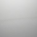 Close-up of a white textured surface, possibly a plain paper or fabric. The texture show Royalty Free Stock Photo