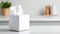 Close-up of a white tissue box with tissues, on a white countertop, blurred background. Royalty Free Stock Photo