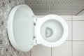 Close-up, White toilet bowl view from above. The concept of cleanliness in the house, hygiene, toilet, microbes Royalty Free Stock Photo