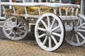 Close-up of vintage old rough wooden horse cart in city park, rustic retro transport Royalty Free Stock Photo