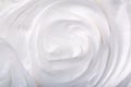 Close up of a white whipped or sour cream on white background