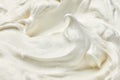 Close up of a white whipped cream on white background