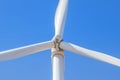 Close up white wind turbine generating electricity with blue sky Royalty Free Stock Photo