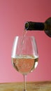Close-up of white wine being poured into glass, with bubbles indicating carbonation Royalty Free Stock Photo