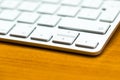 Close up of white wireless aluminum keyboard