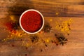 Paprika powder in wooden bowl with anise Royalty Free Stock Photo