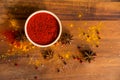 Paprika powder in wooden bowl with anise Royalty Free Stock Photo