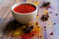 Paprika powder in wooden bowl with anise Royalty Free Stock Photo