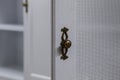 White wooden kitchen cabinet door handle Royalty Free Stock Photo