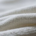 Close-up of white woven fabric, displaying its textured surface with interlocking thread Royalty Free Stock Photo
