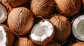 Close-up of whole and halved coconuts