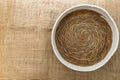 Close-up of wicker basket on burlap for rustic food styling Royalty Free Stock Photo