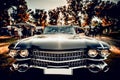 Close-up wide-angled photo of black vintage retro car with shining chrome radiator grille, bumper and headlamps Royalty Free Stock Photo
