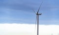 Wind turbine shot against a dark stormy skyline Royalty Free Stock Photo