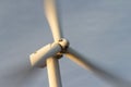 Close up of a wind turbine spinning and generating electricity.