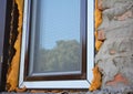 Close up on window insulation with foam. Windows installation.