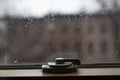 Close up of window latch. Window hasp. Rain drops on a glass