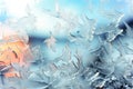 A close up of a window with water drops, frost and snow figures on an icy window in winter